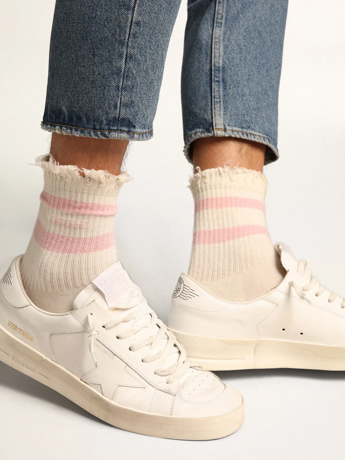 Distressed-finish white socks with baby-pink logo and stripes